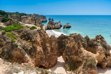 Fototapeta na wymiar Praia tres irmaos - Beautiful coast and beach of Algarve - Portugal