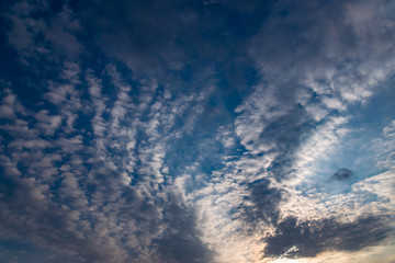 Dramatic sky with white clouds.