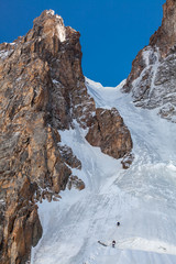 Fototapeta na wymiar Ice climbing on wall in Tian Shan mountains