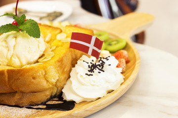honey and almond honey toast with vanilla ice-cream, over light
