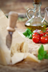Italian Parmesan cheese with cherry tomato and olive oil