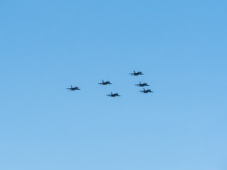 Yakovlev Yak-130 (Mitten) subsonic advanced jet trainer/light attack aircrafts of Tavrida Wings form unique aerobatic triangle figure Pyramid on blue sky background