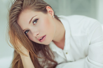 Portrait of a beautiful woman in the morning bed 