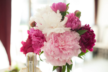 stylish luxury cute  small   bouquet of  colored peonies