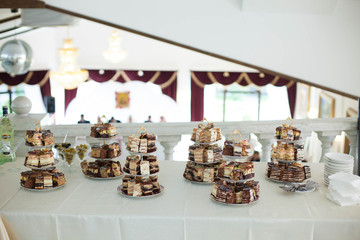 buffet table with traditional sweets and cakes on the background