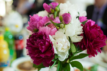 stylish luxury cute  small   bouquet of  colored peonies