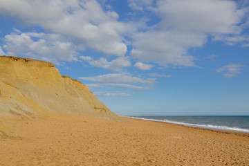 Fototapeta na wymiar coastal sand cliffs and Hive beach Burton Bradstock, Dorset, England