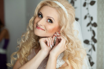 beautiful gorgeous stylish bride getting prepared in the morning