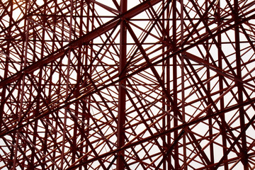 Structural orange steel cross construction abstract background
