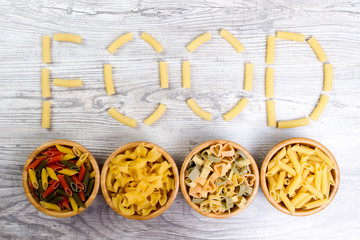 Pasta lined the floor - food on wooden background