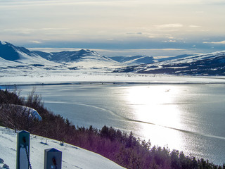 Snowcapped mountain and Lake in Akureyri city, Iceland
