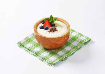 Smooth semolina porridge with fresh fruit and chocolate
