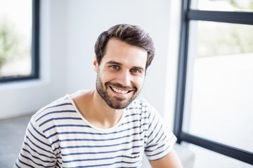 Obraz premium Portrait of happy man sitting on steps
