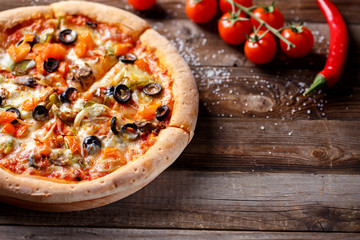 Vegeterian pizza with mushrooms and olives