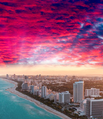 Sunset over Miami Beach skyline, helicopter view