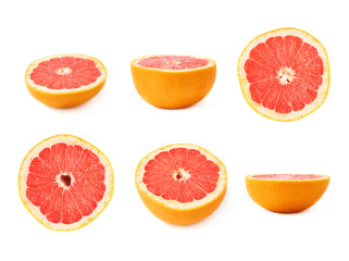 Single ripe grapefruit cut in half isolated over the white background