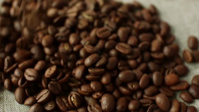 Falling aromatic roasted coffee beans