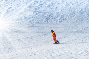 Fototapeta na wymiar snowboarder rides the mountain
