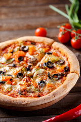 Pizza with tomato, mushroom and olives