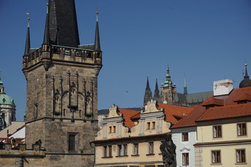 Fototapeta na wymiar Top of the Prague castle above the red roofs in the capital city of the Czech Republic, Prague