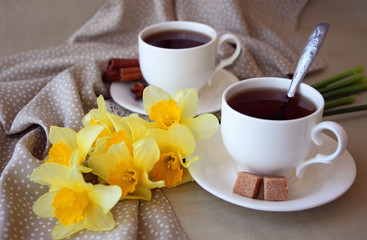 Cups of tea and an armful of daffodils..