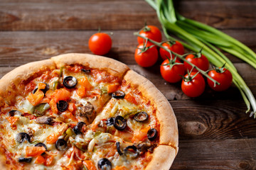 Pizza with tomato, mushroom and olives