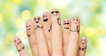 close up of hands and fingers with smiley faces