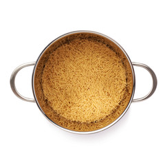 Metal pan filled with dry noodles pasta over isolated white background