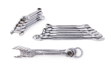 Set of stack of wrenchs metal instruments isolated over white background