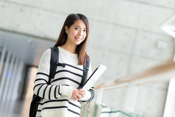 Woman with backpack and laptop computer