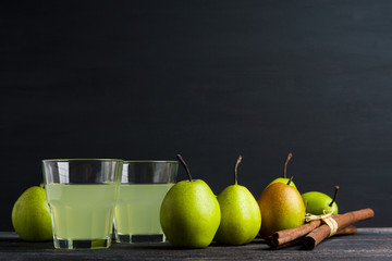 Fresh pears on a rustic wooden background