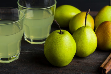 Fresh pears on a rustic wooden background