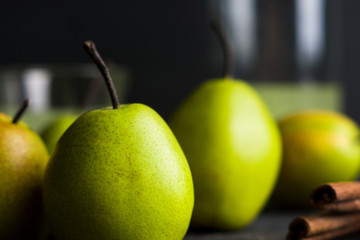 Fresh pears on a rustic wooden background