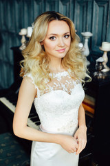 Portrait of beautiful young bride with curly hair