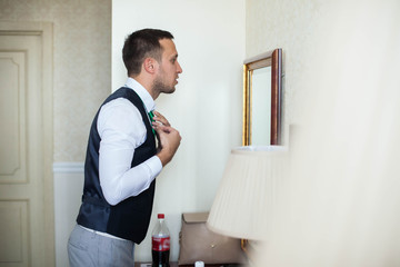 stylish handsome successful confident man in a posh classic room