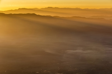 Fototapeta na wymiar Colorful summer morning with golden light and fog between hills at Doi Luang Chiang Dao, High mountain in Chiang Mai Province, Thailand
