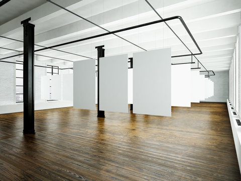 Photo of loft interior in modern building.Open space studio. Empty white canvas hanging.Wood floor, bricks wall,panoramic windows. Blank frames ready for bussiness information.Horizontal. 3d rendering