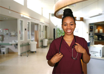 Attractive African American nursing professional in hospital waiting room