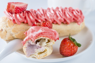 eclair with strawberry, shallow depth of field