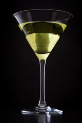 Green apple cocktail on black background
