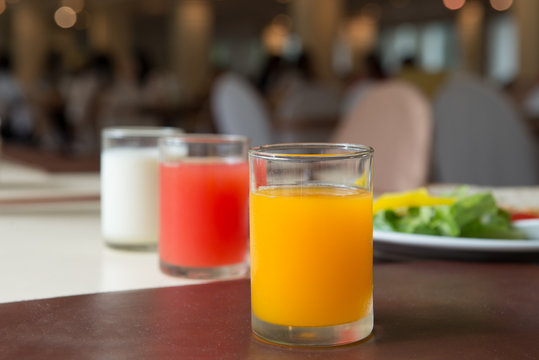 Glass of Orange Juice in Dining Room