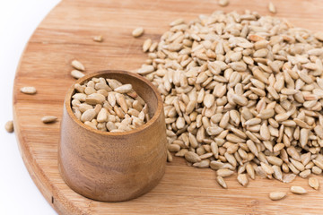 Wooden cup with sunflower seeds