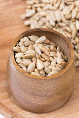 Wooden cup with sunflower seeds