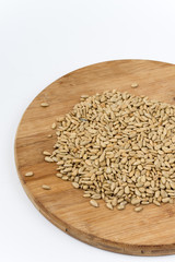 Sunflower seeds on the wooden board