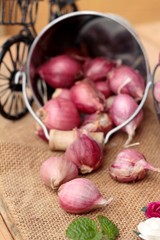 raw shallots for cooking on wood background.