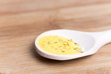 Mixed spices in the wooden spoon