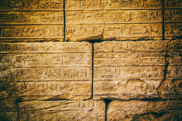 old egypt hieroglyphs carved on the stone