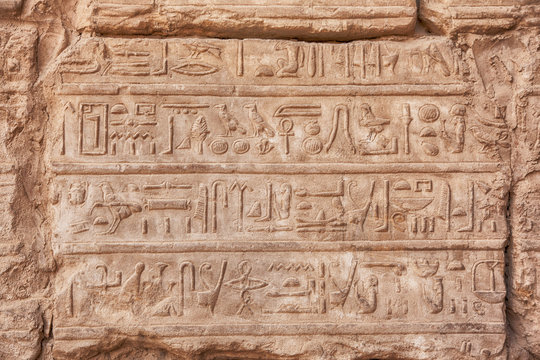 old egypt hieroglyphs carved on the stone