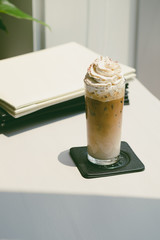 Ice coffee on white table