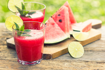 Watermelon juices with lime and mint in the glass